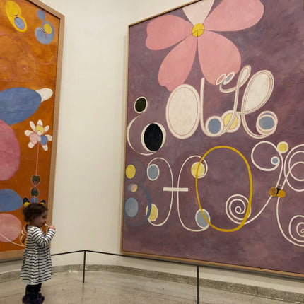 Child standing before a large Hilma af Klint painting at the Guggenheim Museum's "Paintings for the Future" exhibition - image credit Shilo Ratner 