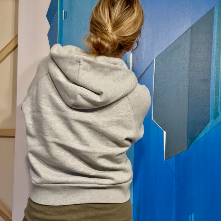 Shilo Ratner working in her art studio creating geometric paintings