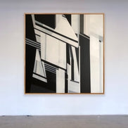 Abstract painting 60x60 black and white geometric art by Shilo Ratner on studio wall